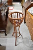 A bentwood torchere/jardiniere stand