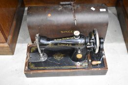 A vintage dome cased Singer sewing machine