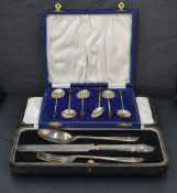 A George V cased silver three-piece christening set, comprising knife, fork and spoon, each
