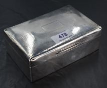 An Edwardian silver cigarette box, of hinged rectangular form with engine-turned decoration and