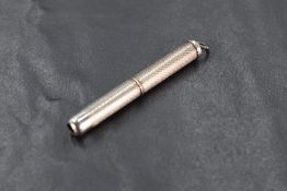A silver tooth pick having retractable pick and engine turned decoration, Birmingham 1979, William