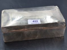 A damaged 1930's silver cigarette box of plain form with engraved signature to lid, marks worn,