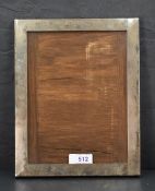 An early 20th Century silver photograph frame of plain rectangular form having wooden back,