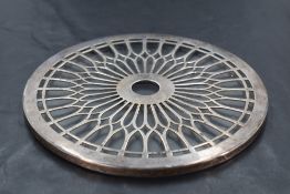 A George V silver and glass teapot stand, of circular form with repeating spoke design, marks for