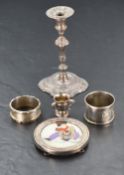 A small selection of HM silver including petit candle stick, two napkin rings, miniature trophy