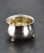 A Russian white metal cauldron-form salt, with three ball feet, marked with St Petersberg