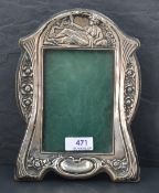 An Edwardian silver photograph frame of Art Nouveau design having leather easel back, Birmingham