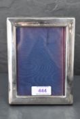 An Elizabeth II silver-mounted photograph frame, of plain rectangular form, marks for Sheffield