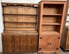A modern pine dresser, the moulded cornice above three shelves,