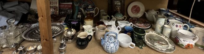 A collection of Cardiff books together with an electroplated and glass four bottle cruet,