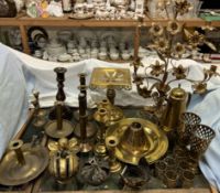A gilt metal candelabra with flowerheads and leaves together with crowns, brass candlesticks,