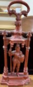 A cast iron door stop in the form of a knight in a portico