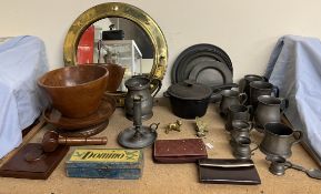 A collection of pewter tankards together with a mirror, treen, saucepan,