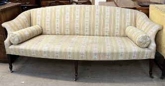 A 19th century mahogany settee with out swept arms on square tapering legs, spade feet and casters,