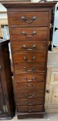 A 20th century mahogany chest with ten drawers on bracket feet