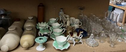 Stoneware foot warmers together with a leaf decorated part tea set, drinking glasses,