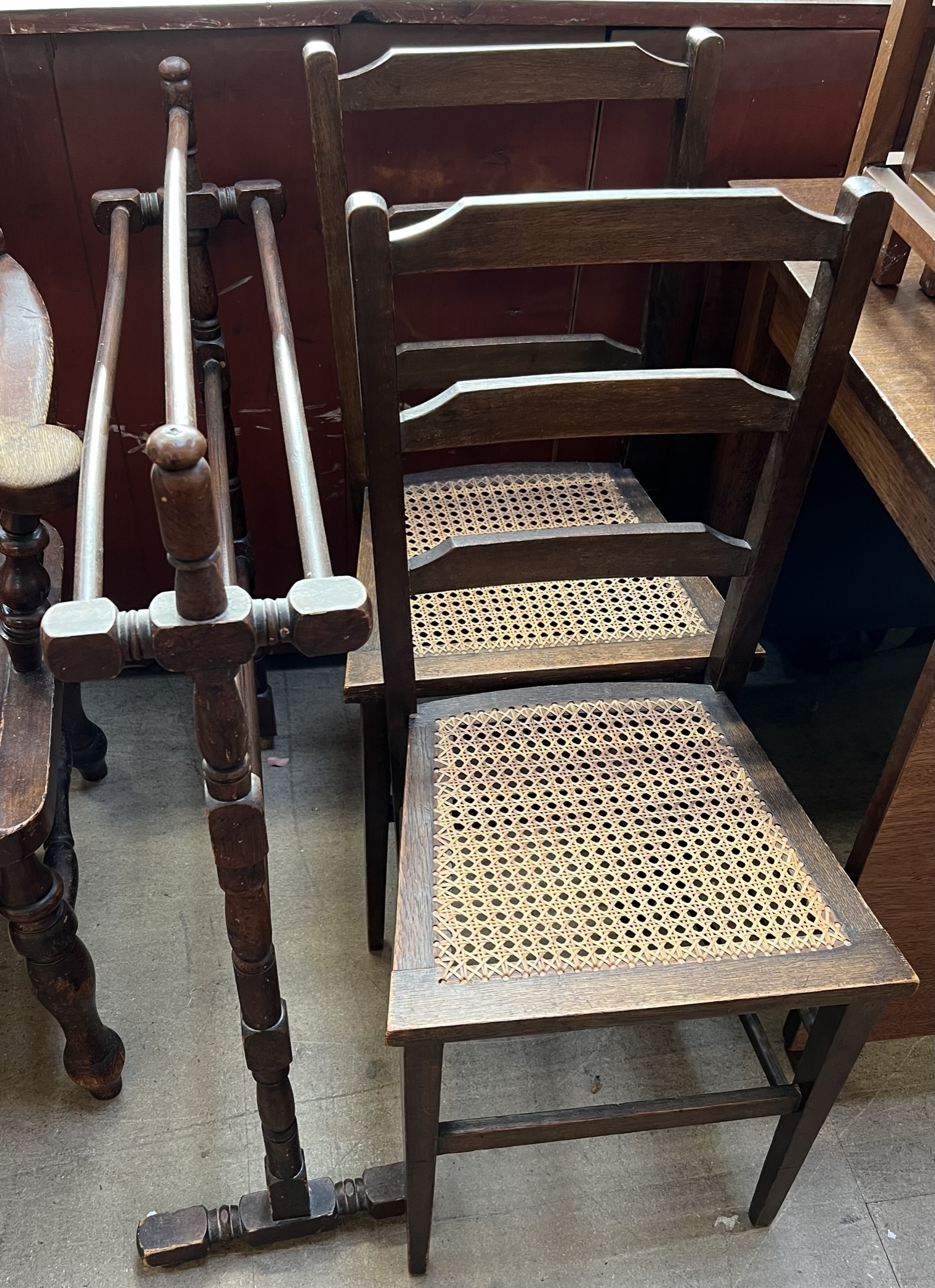 A pair of bedrock chairs and a towel rail