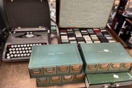 A Smith Corona typewriter together with a collection of photographic slides etc