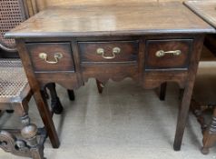 An 18th century oak lowboy,