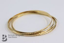 Five 9ct Gold Bangles