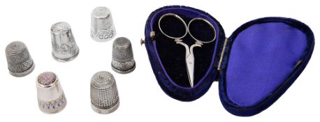 Six silver and other thimbles
