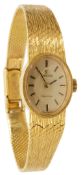 An 18K ladies Omega bracelet wristwatch
