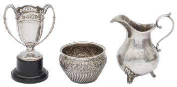 A Victorian silver milk jug, a twin handled trophy cup and a sugar bowl
