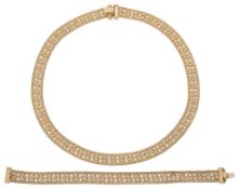 A matching fancy link necklace and bracelet