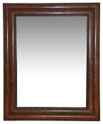 A late 19th century faux tortoiseshell wall mirror