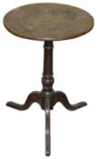 An early 19th century small oak tripod wine table