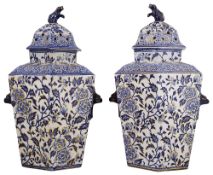 A pair of mid 19th century blue and white pot pourri jars and covers