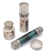 Three Victorian silver mounted scent bottles and a silver rouge pot