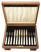 A set of six George V mother of pearl handled fruit knives and forks, Sheffield
