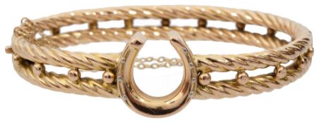 A late 19th century 15ct yellow gold hollow hinged bangle