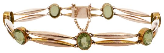An Edwardian peridot and 15ct yellow gold bracelet