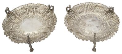 A pair of late Victorian silver embossed bonbon dishes