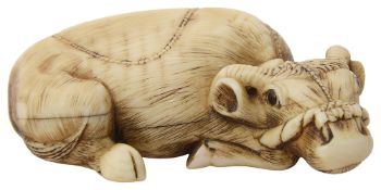 A Japanese ivory netsuke of a buffalo