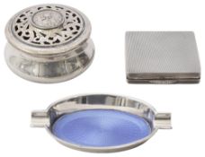 An Edwardian silver pot pourri pot, a silver and enamel ashtray and a compact