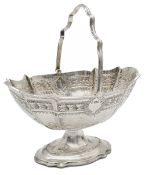 A late Victorian silver swing handled sugar basket