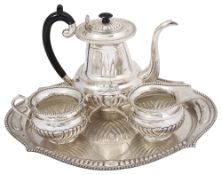 An Indian three piece silver tea service and a tray