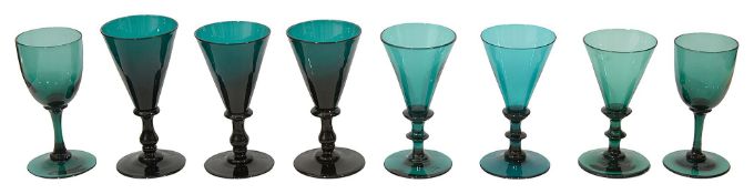 A harlequin set of eight Georgian green drinking glasses