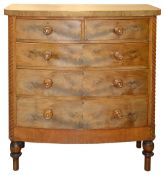 An early 19th century mahogany bow fronted chest of drawers