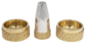 A modernist silver gilt three piece cruet set