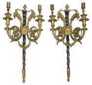 A pair of French Louis XVI style gilt bronze twin light appliques after Pierre Gouthiere
