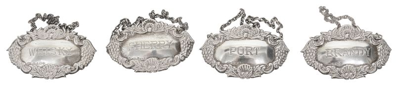 A set of four modern silver decanter labels