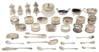 A collection of silver cruet items napkins rings and other items