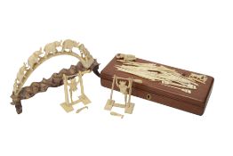 An Chinese ivory acrobat, a bone acrobat and a carved hippo tusk