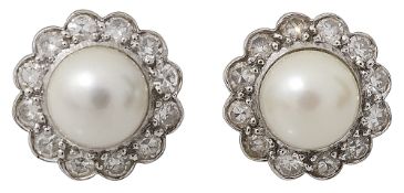 A pair of cultured pearl and diamond-set cluster earrings