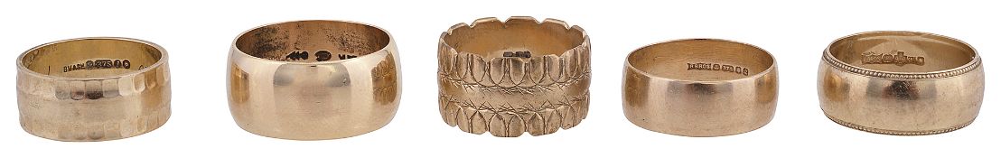A 14K gold wedding band and four 9ct gold wedding bands