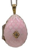A silver and pink enamel ovoid locket pendant by Theo Faberge